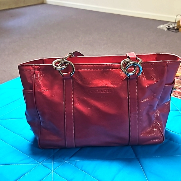 Coach Handbags - Hot pink coach purse with bold silver accent on straps.